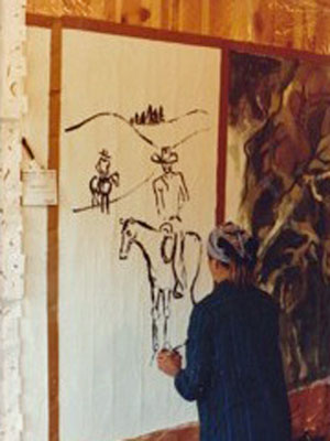 Nancy Barth sketching the outlines of her painting