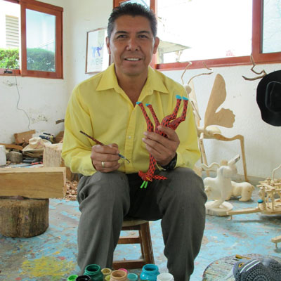 Isaiah Jimenez in his workshop, Arrazola